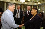 Former Assembly Member Jerome Waldie shaking hands with Assembly Member Karen Bass