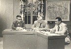 Arthur Ohnimus, Charles Johnson, and Harvey Chester on set of television show, circa 1950s. Harvey Chester is listed in 1957 Handbook as accredited press representative for KCCC-TV.