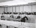 Assembly Leadership/Rules Committee in Room 4202 on February 8, 1962. Showing Jerome Waldie, John T. Knox, Tom Bane, Eugene Nisbet, Carlos Bee, Augustus Hawkins, Speaker Jesse Unruh, Jack Schrade, Charles Conrad, Harold Sedgwick, Asst. Sgt at Arms Wes Mun
