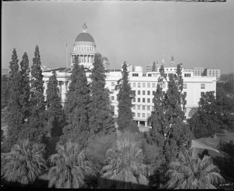 View of the Capitol complex showing old Capitol and newly constructed Annex, circa 1952. Photo taken from top of state building at 12th and N Streets.