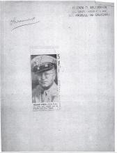 Kyle Palmer wearing a police like hat. The description underneath the picture reads: Bound West-Kyle Palmer, who will report war in Pacific for The Times.