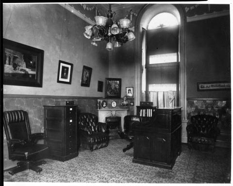 Photo of an office in the Capitol building. Appears to be turn of the century, circa 1900.