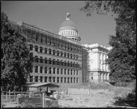 Capitol Annex under construction, May 1950. Exterior view showing steel beam construction of the Annex (black and white photo).